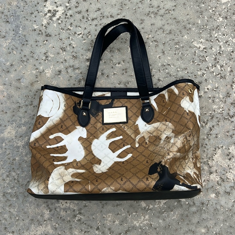 L.A.M.B. purse Gwen Stefani